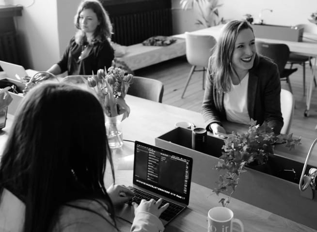 A picture of people working in an office.